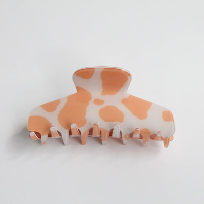 Resilient peach hair claw clip